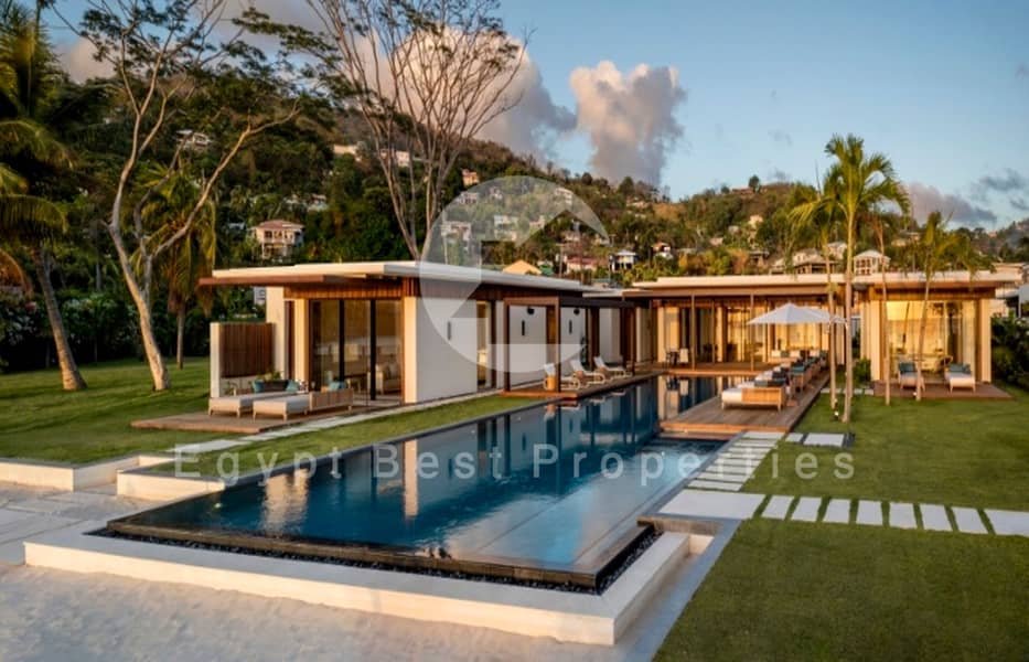 6 Beachfront-Villa-Pool-and-Lawn-area-800x418. jpg