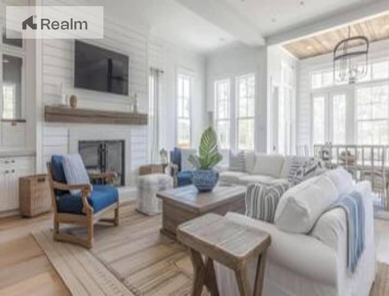 bright-pops-of-blue-and-natural-wood-accents-bring-the-coastal-farmhouse-theme-to-life-in-this-beautiful-beachside-home-photo. jpg