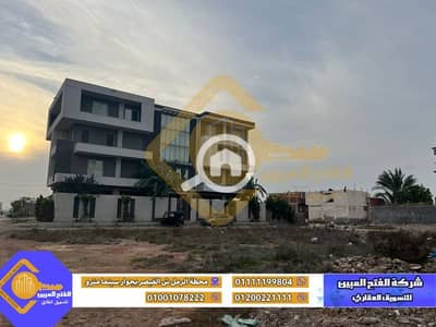 عقارات تجارية اخرى  للبيع في محرّم بيك، الإسكندرية - ارض للبيع خلف المدرسة السويسرية /الطريق الرئيسي الدائري