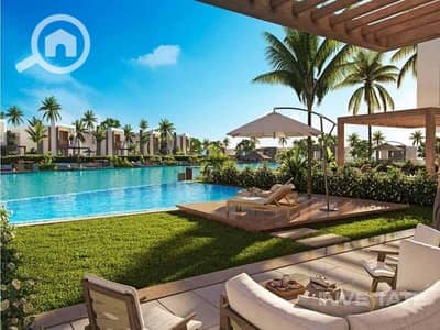5 Bedroom Villa for Sale in North Coast, Matruh - exterior-pool-view-hacienda-bay-water-villas-north-coast-palm-hills-2. jpeg