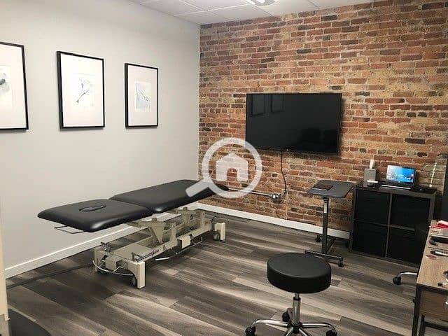 Chiropractic Adjustment Area with Exposed Brick. jpeg