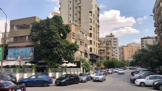 أرض سكنية  للبيع في مصر الجديدة، القاهرة - ٢ شارع الشهيد عبد المنعم حافظ - العمارة إللى فيها كافيه جوستو