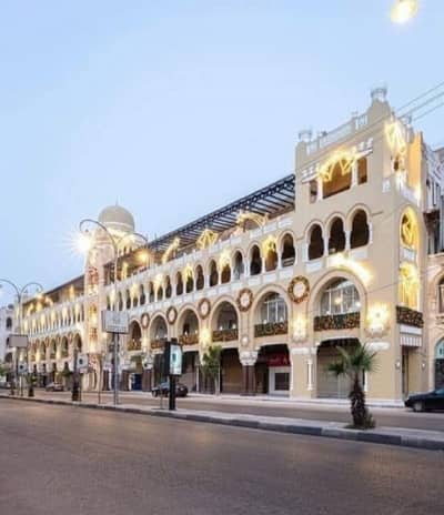 محلات تجارية  للايجار في مصر الجديدة، القاهرة - محل للايجار بالكوربة شارع بغداد في أهم واميز المواقع