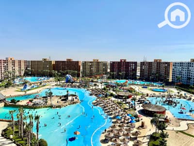 2 Bedroom Chalet for Sale in North Coast, Matruh - شاليهك علي الاكوا بسعر لقطه فيو رائع علي الالعاب المائيه