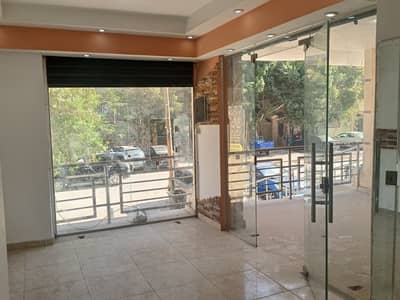 محلات تجارية  للايجار في حدائق الاهرام، الجيزة - محل للايجار بشارع مميز رئيسي حيوي بحدائق الاهرام