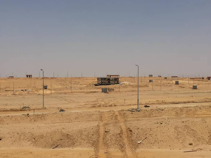 قطعه ارض علي شارع رىيسي امام بالم هيلز نيو كايرو وجهه بحري