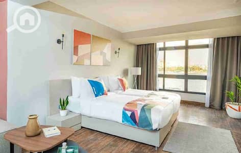 شقة فندقية  للايجار في حى الجيزة، الجيزة - 1000105571. jpg