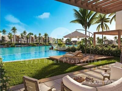 شاليه 2 غرفة نوم للبيع في الساحل الشمالي، مطروح - exterior-pool-view-hacienda-bay-water-villas-north-coast-palm-hills-2. jpeg