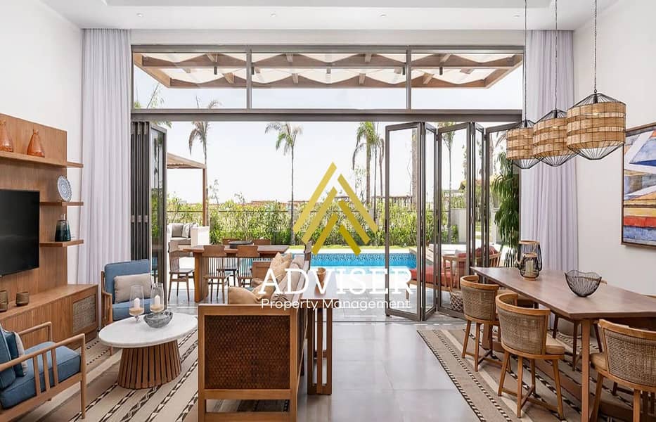 2 SHR-RasSoma-rooms-2BedroomVilla-LivingAndDiningArea-2021102016-fw. jpg