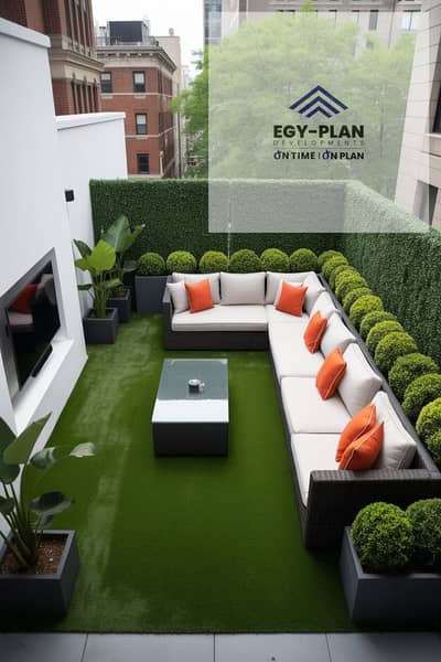 شقة 3 غرف نوم للبيع في الشيخ زايد، الجيزة - Modern Rooftop Garden Terrace with Artificial Turf and Orange Accents. jpeg