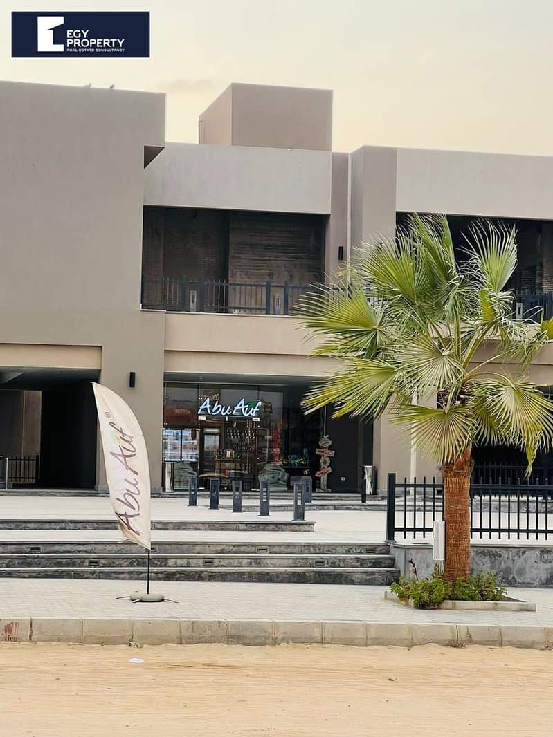 Available for rent, a Kraft Zone shop in Madinaty, exclusive key at the office, a shop of 74 square meters, for food activities, without finishing, requires 60,000, negotiable. - Prikaz 4