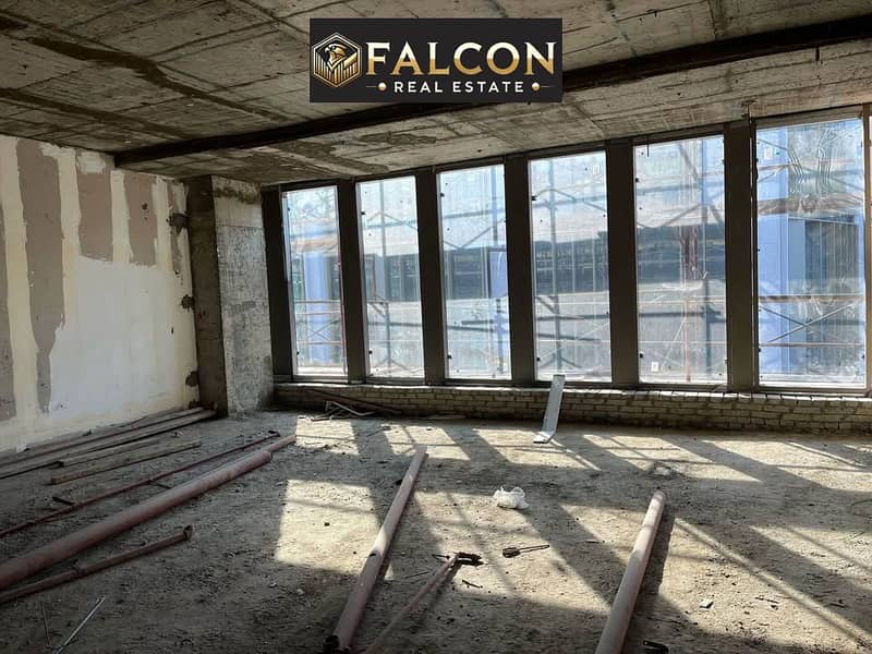 office glass façade amazing location-view lowest price + payment plan for limited time in front of Cairo Festival next to Mivida-Monorail station 90th - Mehr
