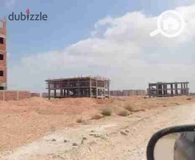 أرض تجارية  للبيع في الشيخ زايد، الجيزة - أرض للبيع تجارية لقطه 4200 متر على طريق مصر اسكندريه الصحراوي الرئيسي وبالقرب من الشيخ زايد