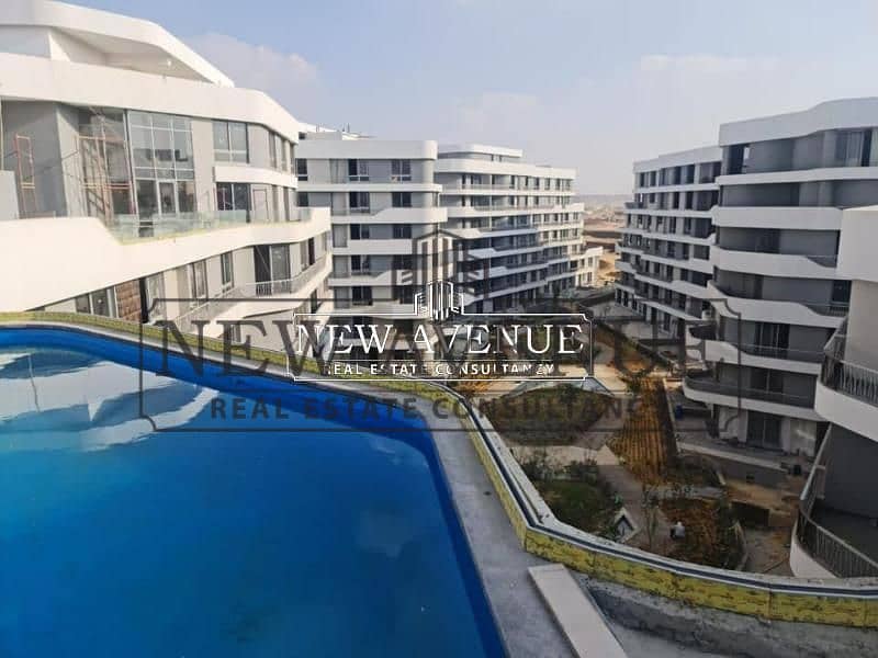 ground apartment with garden installments 2 bedroom in bloom fields phase lake side by tatweer misr in al mostakbal city - Widok 6