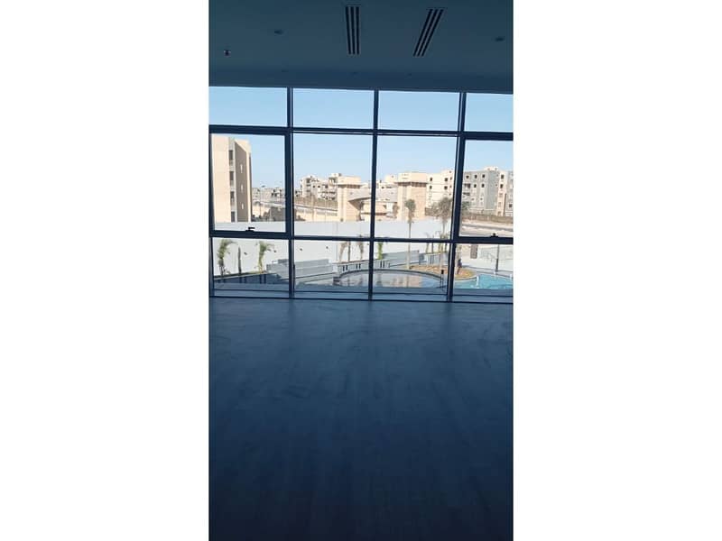 Office 77 m with installments | prime location | for sale at The Ledge Mall – New Cairo, directly behind the American University in Cairo (AUC) - Mehr