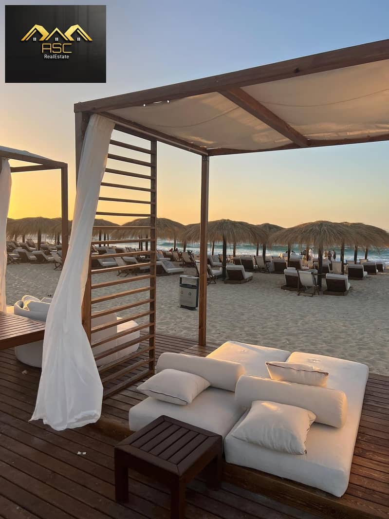 Lowest resale price Penthouse Chalet in Gaia Ras El Hikma - North Coast View of the largest swimming pool In the middle of the village, Second floor - Widok 2
