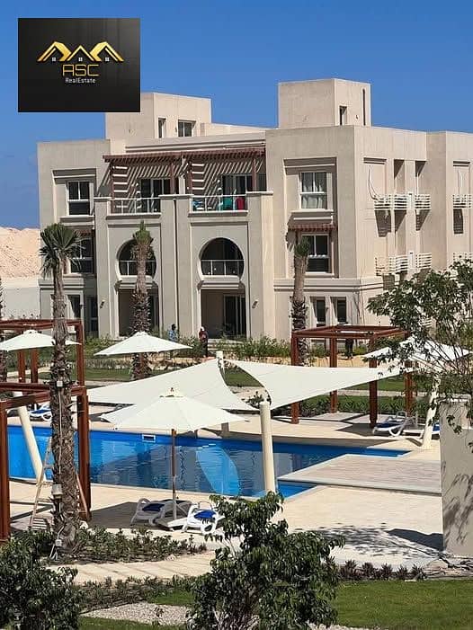Lowest resale price Penthouse Chalet in Gaia Ras El Hikma - North Coast View of the largest swimming pool In the middle of the village, Second floor - Widok 4