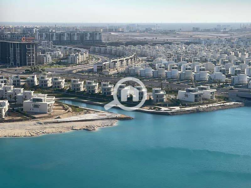 ready chalet fully finished with ac's sea view for sale in alamain towers North Coast. - Altro