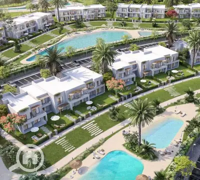 Chalet with a distinctive view overlooking the lagoon, 100m, fully finished, in Sea Shore Ras El Hekma, next to Playa