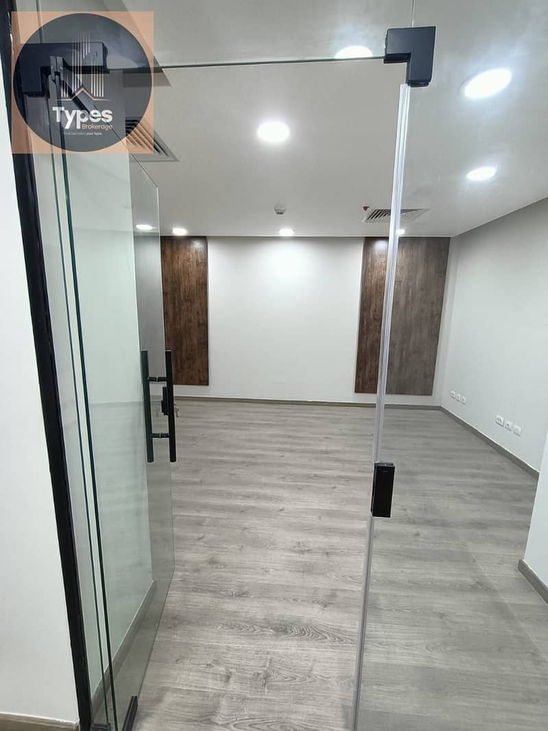 Office space for rent in Tarifium Mall, Sheikh Zayed, facing Americana Plaza and Capital Mall. The space is 88 square meters and includes two rooms - Mehr