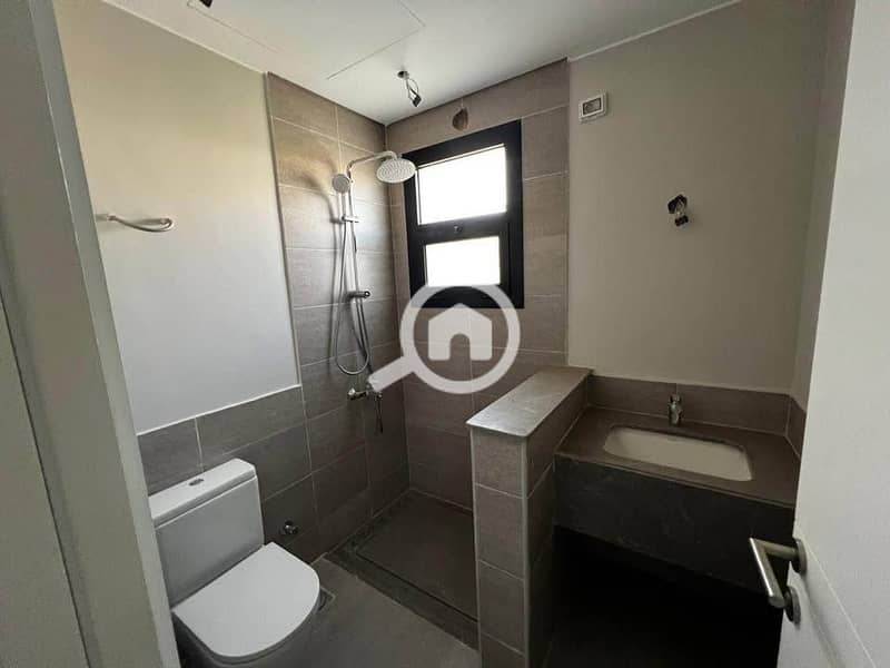 Finished apartment for sale in O West Compound, 3 minutes from Mall of Egypt. - Vista 5
