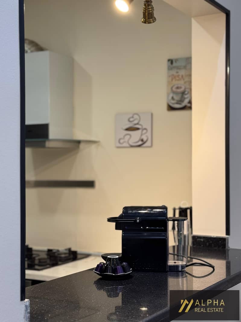 Fully furnished ground floor studio for rent in Porto New Cairo featuring an elegant ultra-modern design and a comfortable layout - Mehr