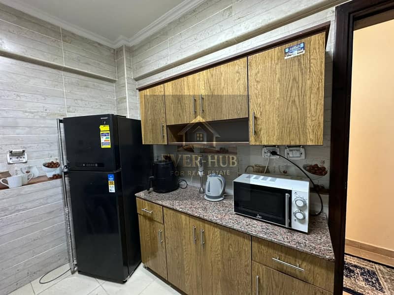 Furnished modern apartment for rent, largest area in the compound, 3 bedrooms + 3 bathrooms, ground floor, open view, near Alia Compound, Jannat Zayed - Meer