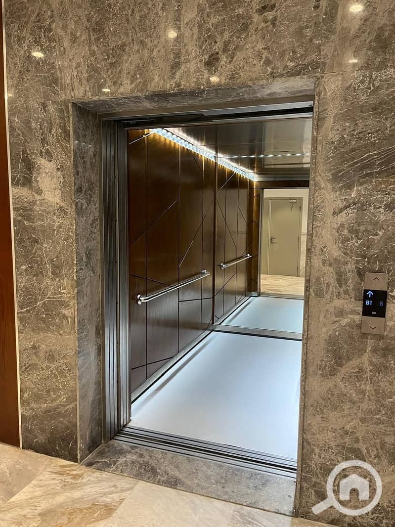 Apartment for sale in October, Aion Towers, Mall of Arabia, two bedrooms with a landscape view over the courtyard, very high-end finishing. - Mehr