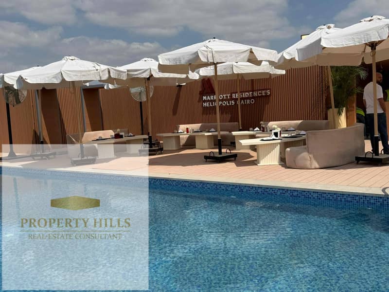 Service apartment for sale in Marriott residence hotel in Heliopolis Near Cairo Airport , Fully Finished with Smart Home & Rental Up to $350 Per Day - Widok 6