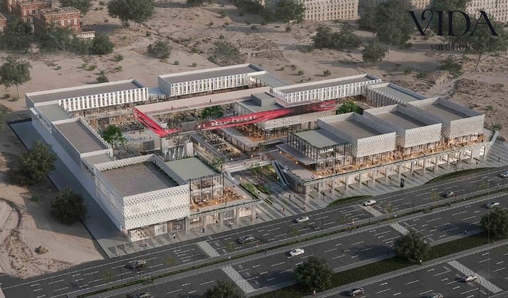 For sale Pharmacy 56 sqm directly on Dahshur Link in Sheikh Zayed Za. Core Mall 5% down payment with installments up to 8 years - Més