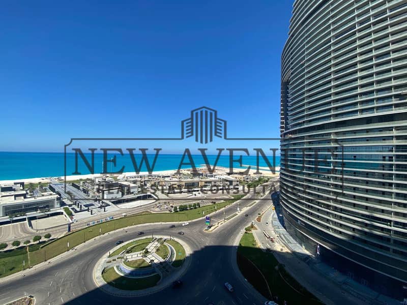 Delivered Sea and lagoon view Chalet Finished with AC in The Gate Towers New Alamein with a Large Balcony – pohled 2