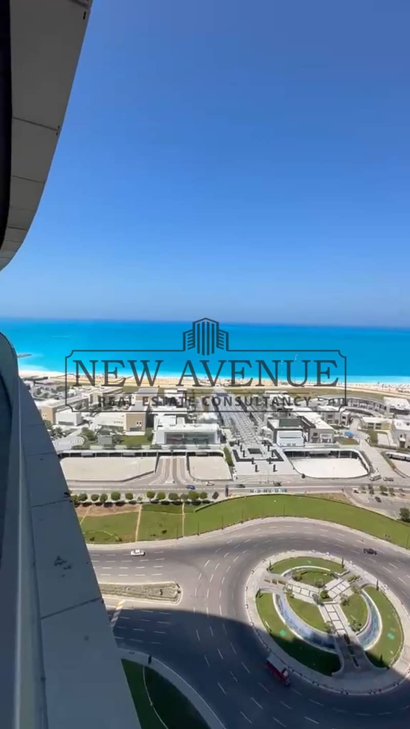 Delivered Sea and lagoon view Chalet Finished with AC in The Gate Towers New Alamein with a Large Balcony – pohled 3