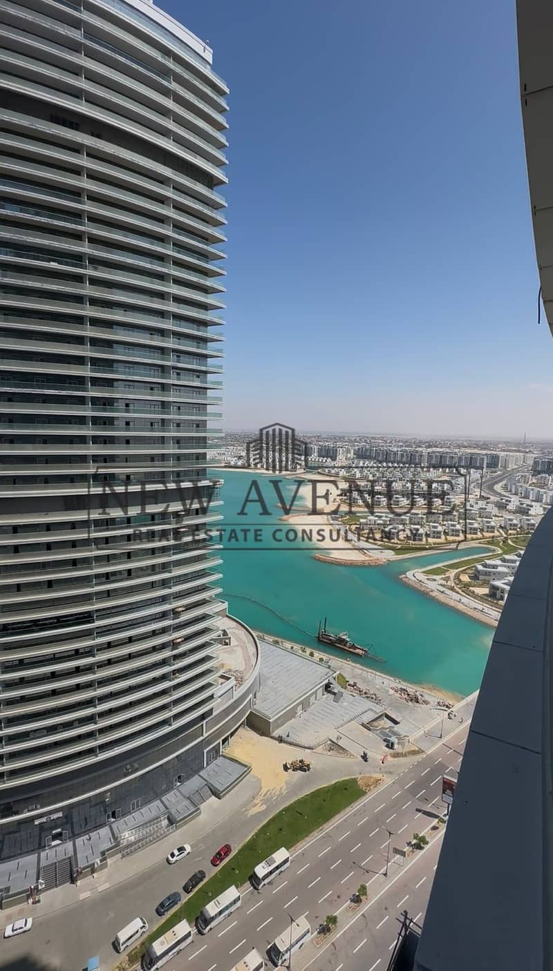 Delivered Sea and lagoon view Chalet Finished with AC in The Gate Towers New Alamein with a Large Balcony – pohled 6