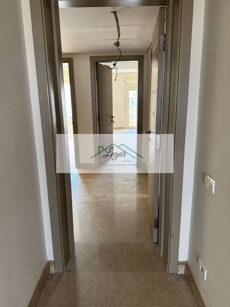 Penthouse with roof for rent in New Giza Compound, 3 bedrooms, first occupancy, at a bargain price. - Widok 5
