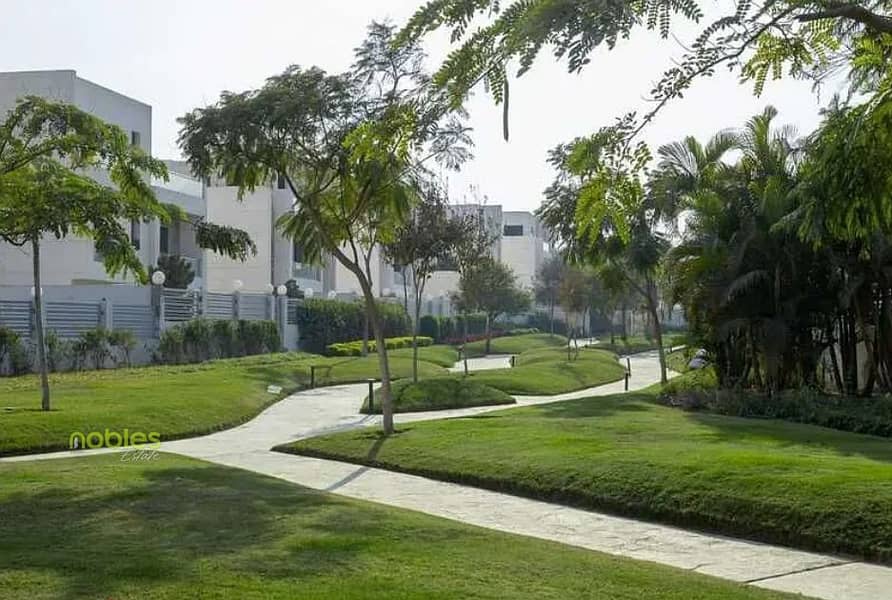 Twin house with a wide garden, ready to move, super deluxe finishing, and in a prime location near Palm Hills and Arkan Plaza in Cleopatra Square - Mehr