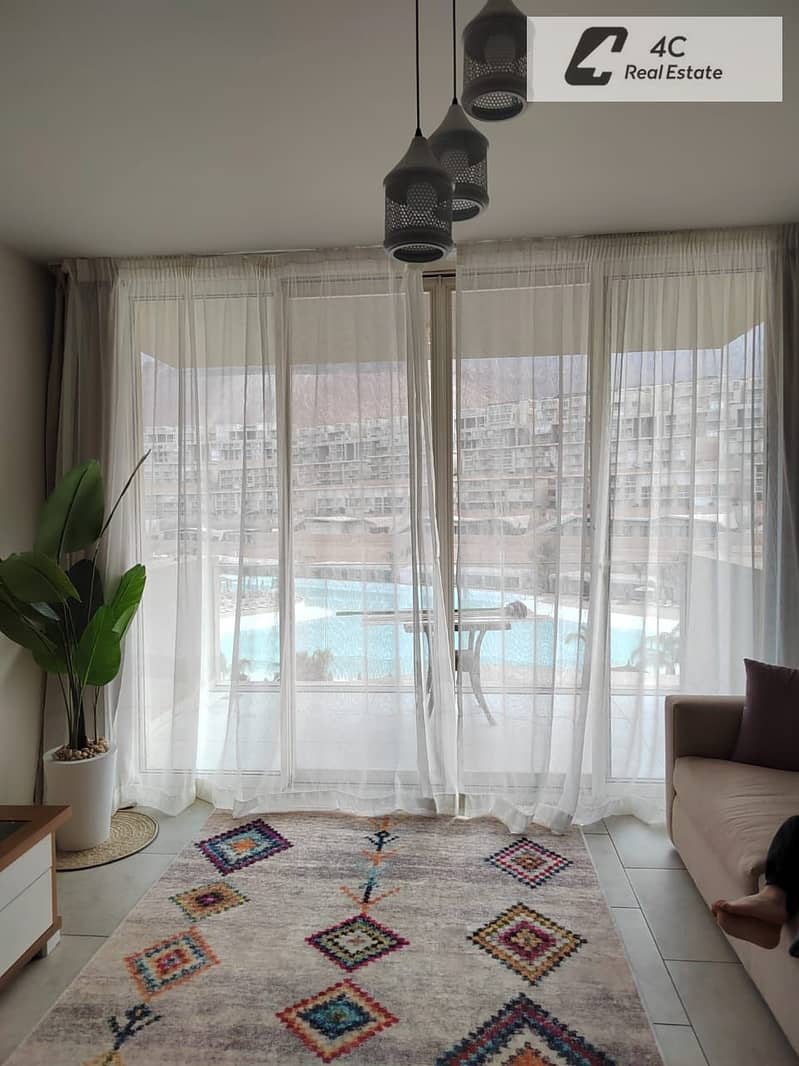 Chalet for sale Ready to move 2 bdr fully finished with Acs & Furniture very prime location view direct lagoon in IL Monte Galala Ain Sokhna - Więcej
