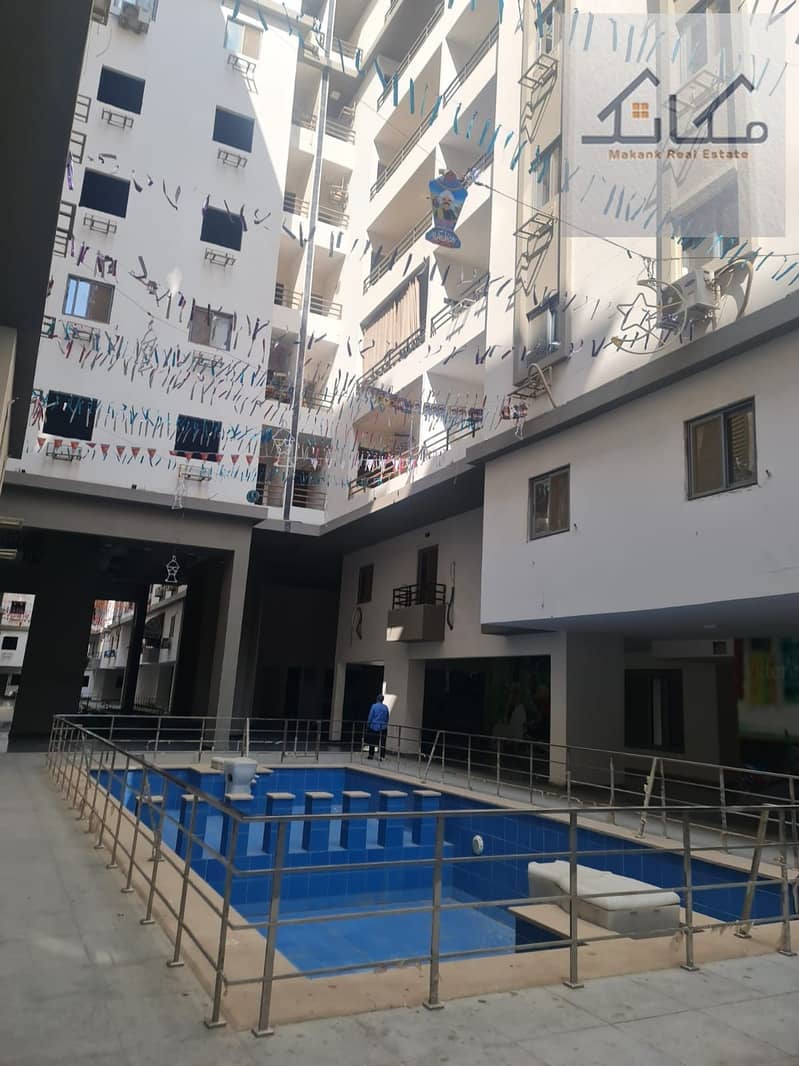 Apartment for sale in the most upscale compounds of Al-Hudba Al-Wasat, District Three - Mehr