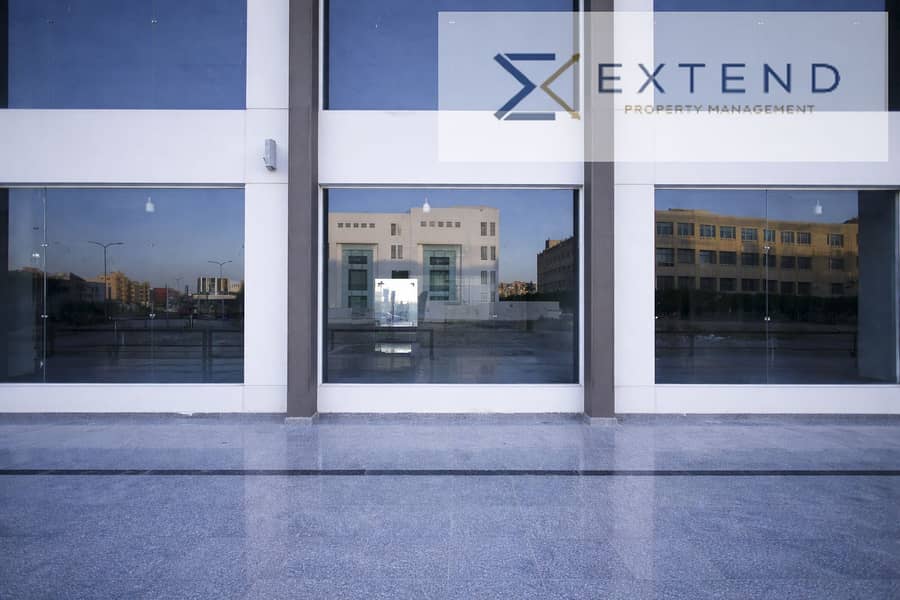 3 Modern commercial building at sunset. png