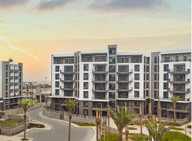 Apt with private garden ,Furnished, ready to move and in a prime location In Aura Compound Cairo Festival, 5th Settlement, New Cairo - Mehr