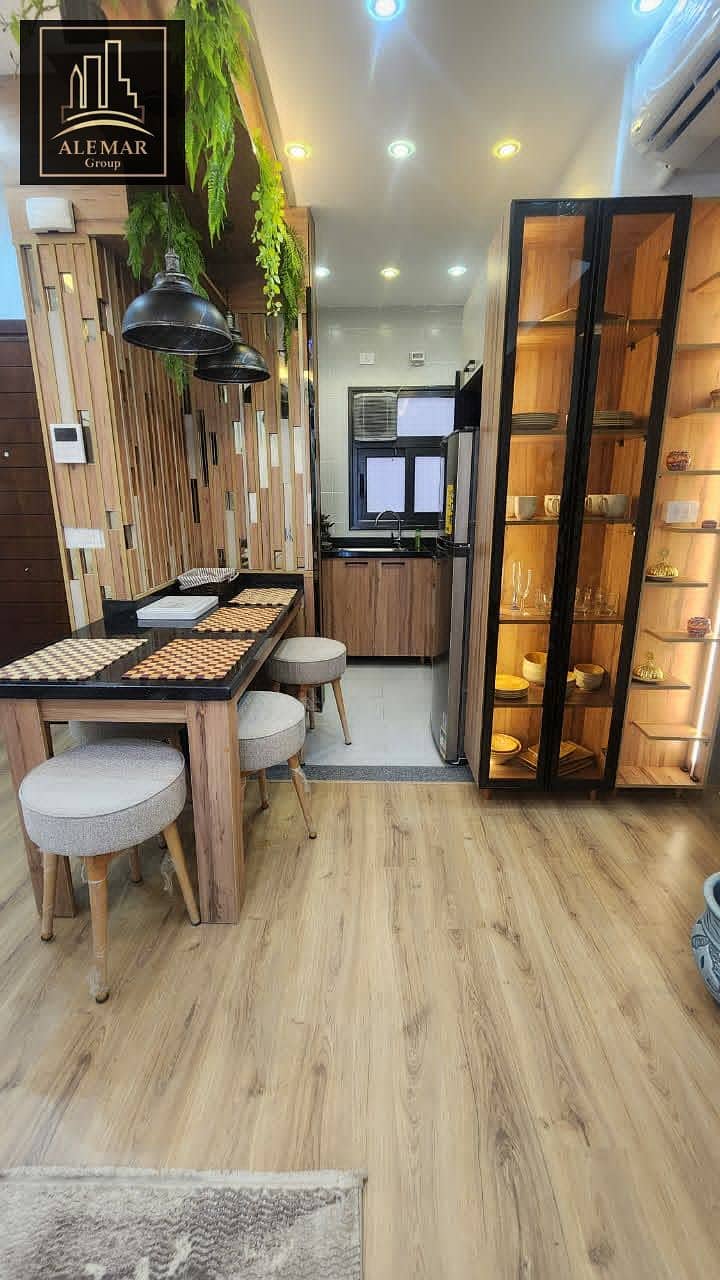 For sale in Privado Madinaty, an 84m² apartment with fully custom finishes, street view, second floor, no additional charge, with a down payment of 4, - Vista 5