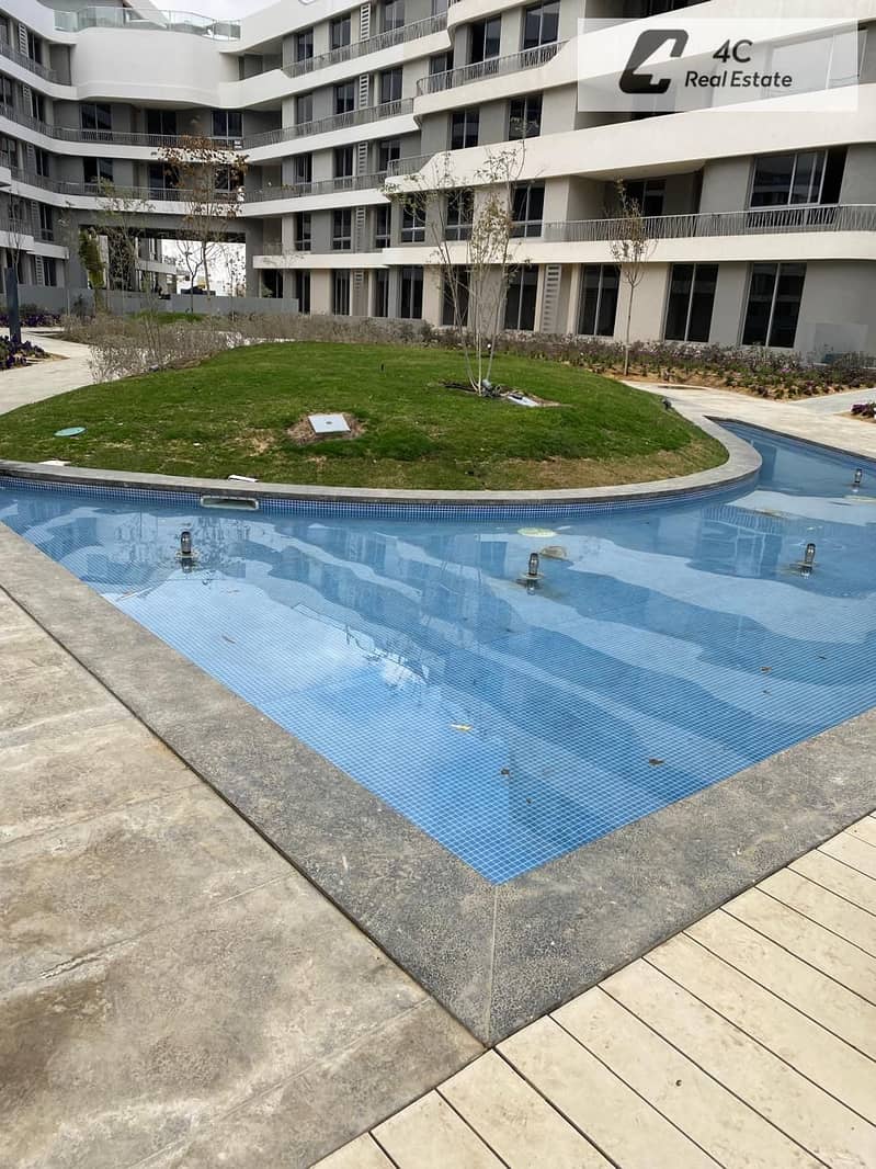 A resale apartment in Bloomfields Mostakbal City with an open view landscape and a distinctive layout available with a down payment and the remainder - Widok 6