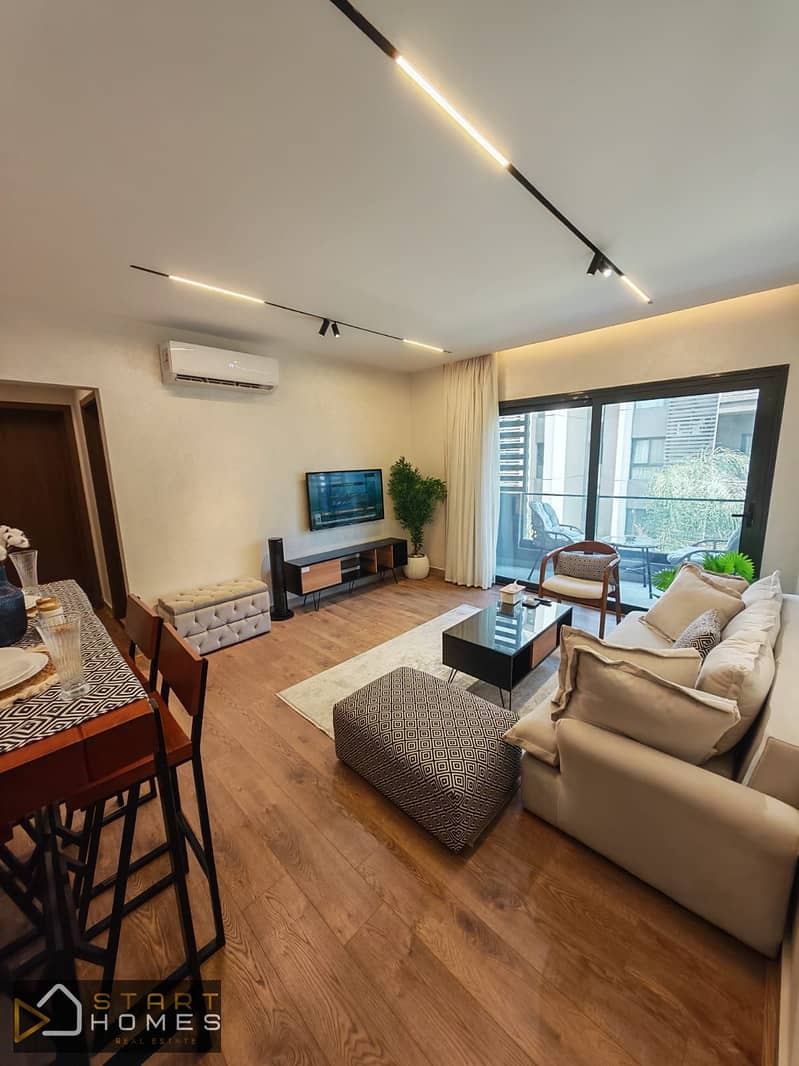 Furnished 67m² 1-bedroom studio for sale in Privado, Madinaty; features a garden view and is just steps away from amenities. - Widok 2