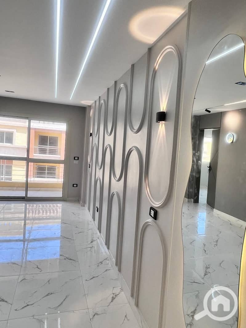 A second-floor corner apartment with a direct northern view, close to the gate and a wide main street, surrounded by landscaping. One of the most distinctive streets in the compound with a wide, open view, and the price is a surprise. - Ansicht 4