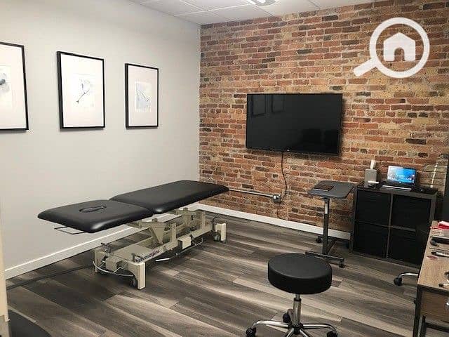 2 Chiropractic Adjustment Area with Exposed Brick. jpeg