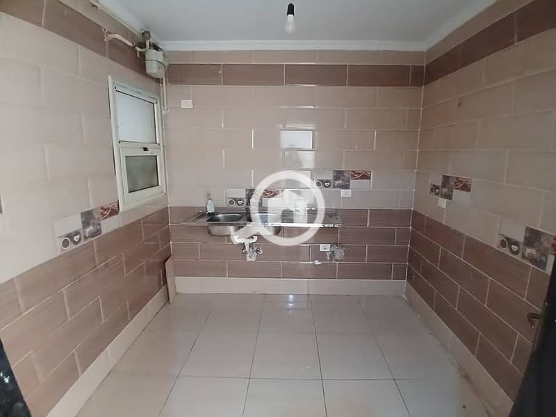 For rent in Dar Misr Al-Qaranful: a 130m² apartment on the second floor. It is located in the second building from the gate and overlooks the Jade com - Vista 6