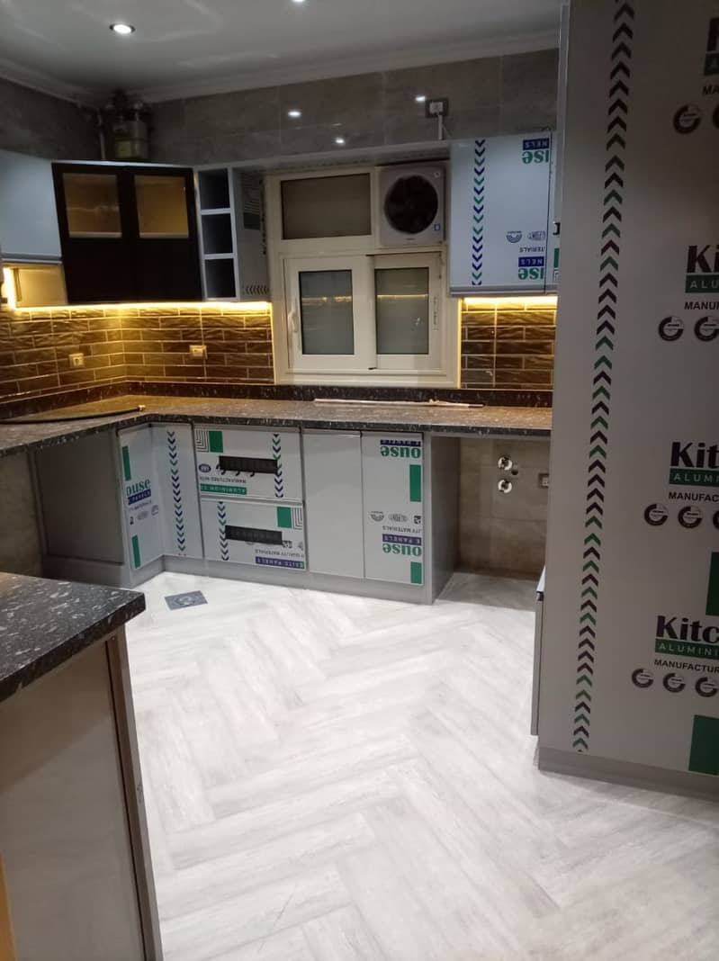 First-time rental: Ultra-modern apartment with a kitchen in the Zayed Heights compound, Sheikh Zayed prime location. - Widok 4