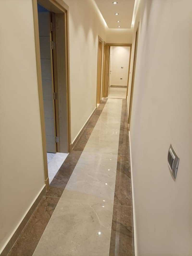 First-time rental: Ultra-modern apartment with a kitchen in the Zayed Heights compound, Sheikh Zayed prime location. - Więcej