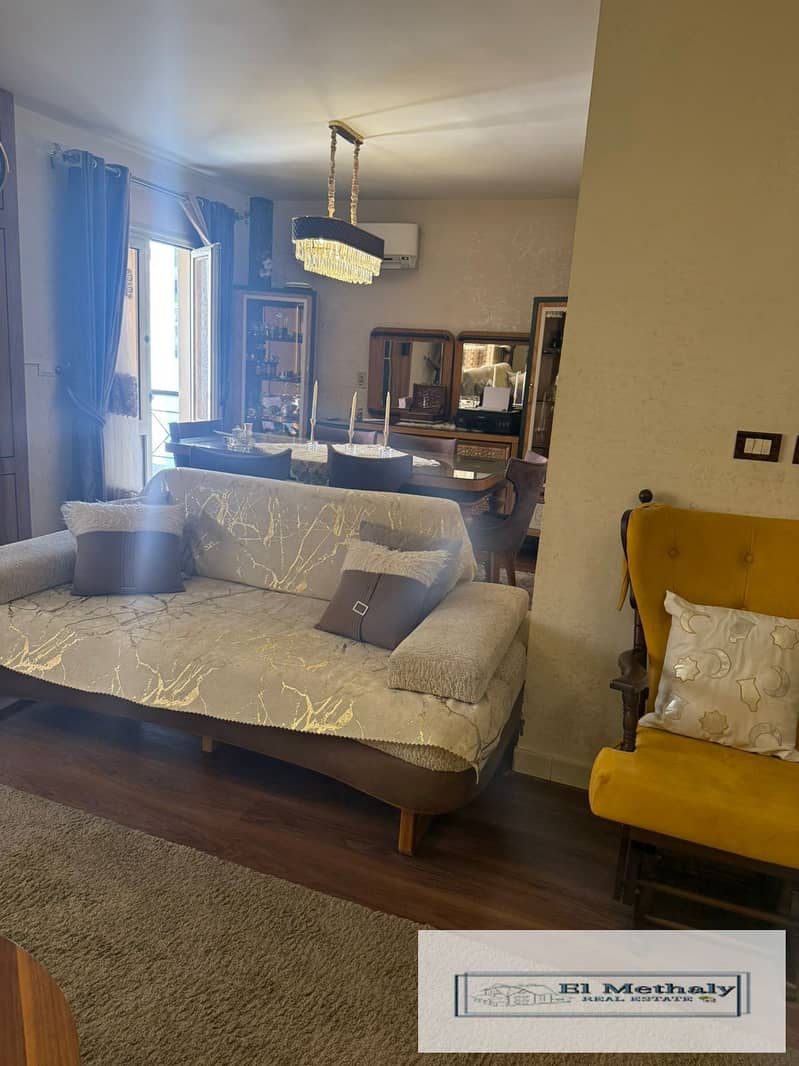 Freehold apartment for sale in Al Rehab City, New Cairo; features a wide garden view and custom, high-end finishes throughout. - Fler