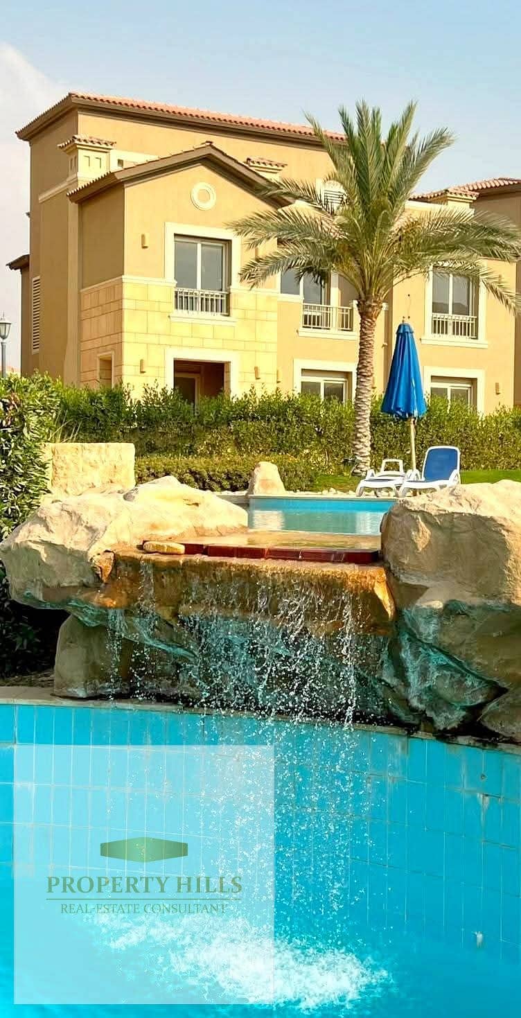 A bargain villa at a discounted price with a waterfall and pool view, fully finished and ready for immediate delivery and move-in, in a prime location in New Cairo, next to Hyde Park, Mivida, 90th Street, and AUC. - Ansicht 2