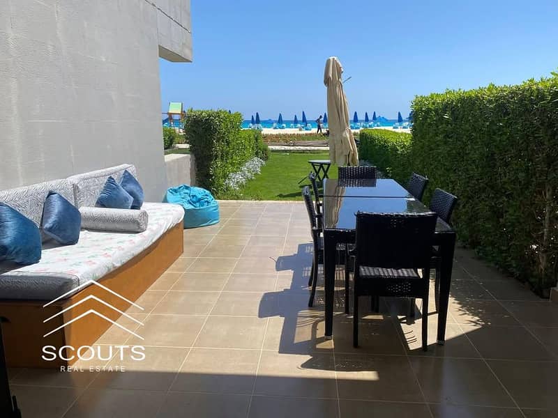 Ground-floor chalet for sale with a 60 sqm private garden, fully finished High-End, ready to move in or rent out, featuring a first-row sea view - Vista 3